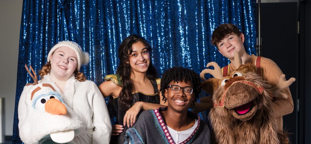 Cast members as Olaf, Anna, Kristoff and Sven from CTA's Frozen