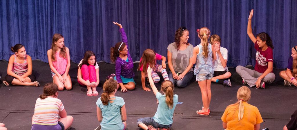 Students raise their arms during a CTA master class in 2011